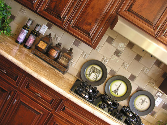 wood kitchen cabinets with granite countertop and tile backsplash